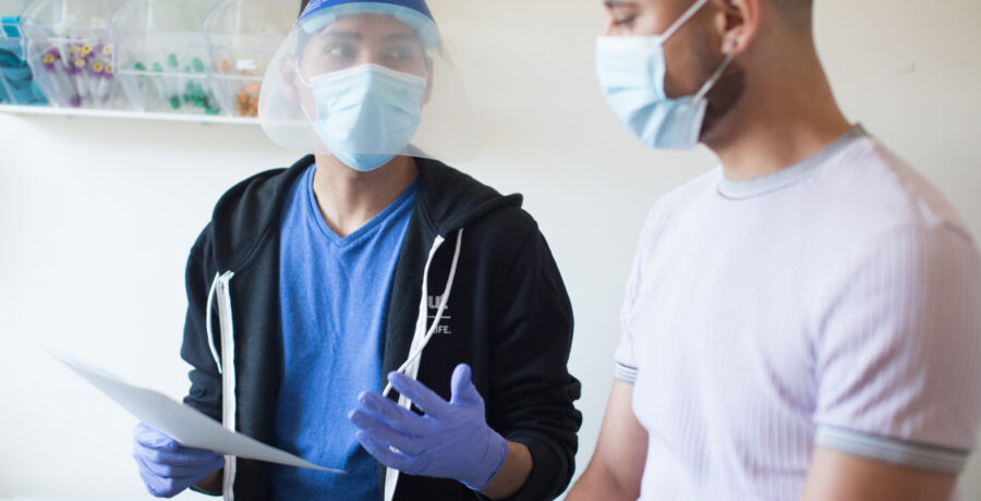 Person receiving health care wearing mask